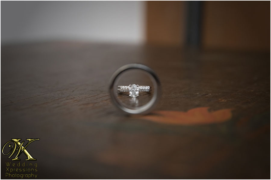 wedding rings on a rustic wood table