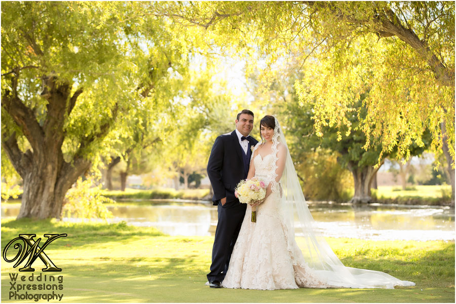 wedding photography in El Paso of couple in front of beautiful lake