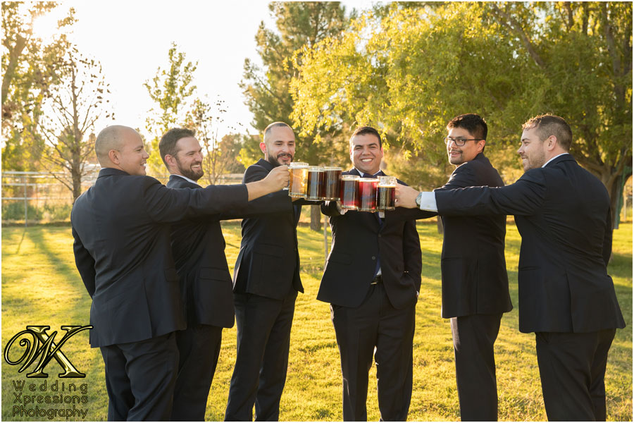 groomsmen toasting with beer mugs