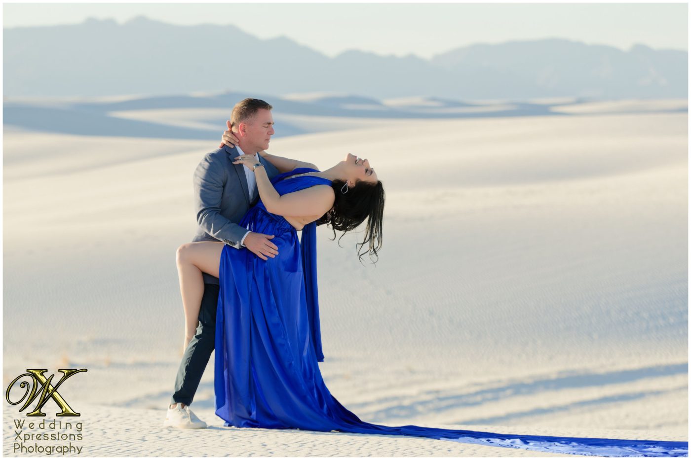engagement session at White Sands in a blue dress