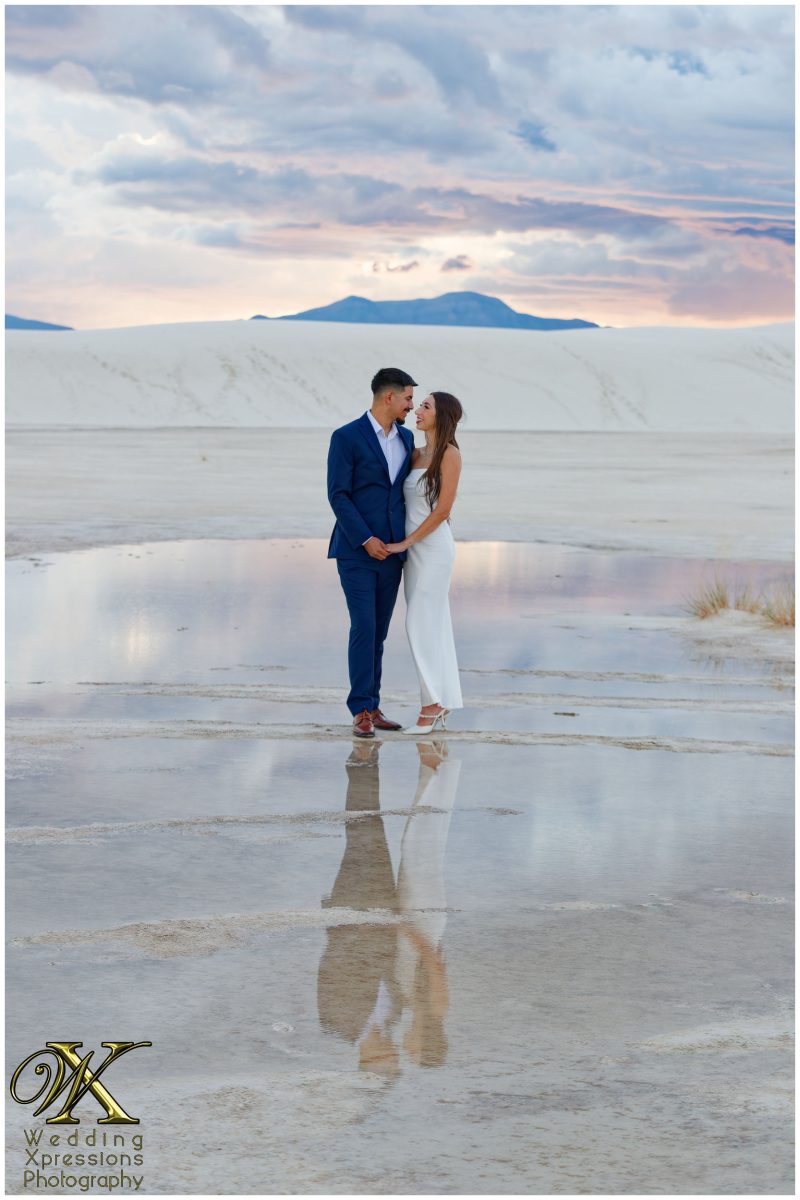 Wide landscape engagement portrait at White Sands National Park.