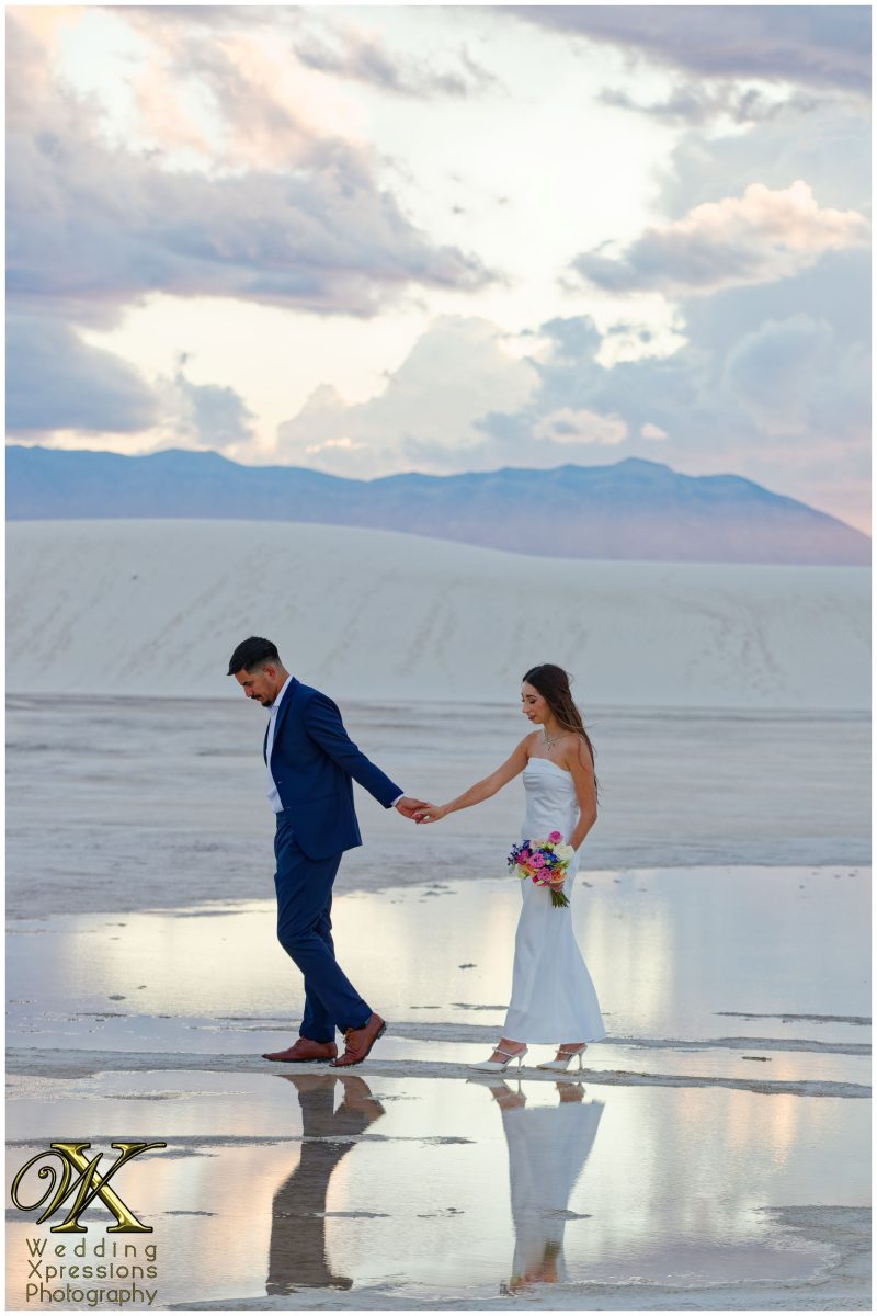 Couple walking toward the horizon at White Sands National Park.