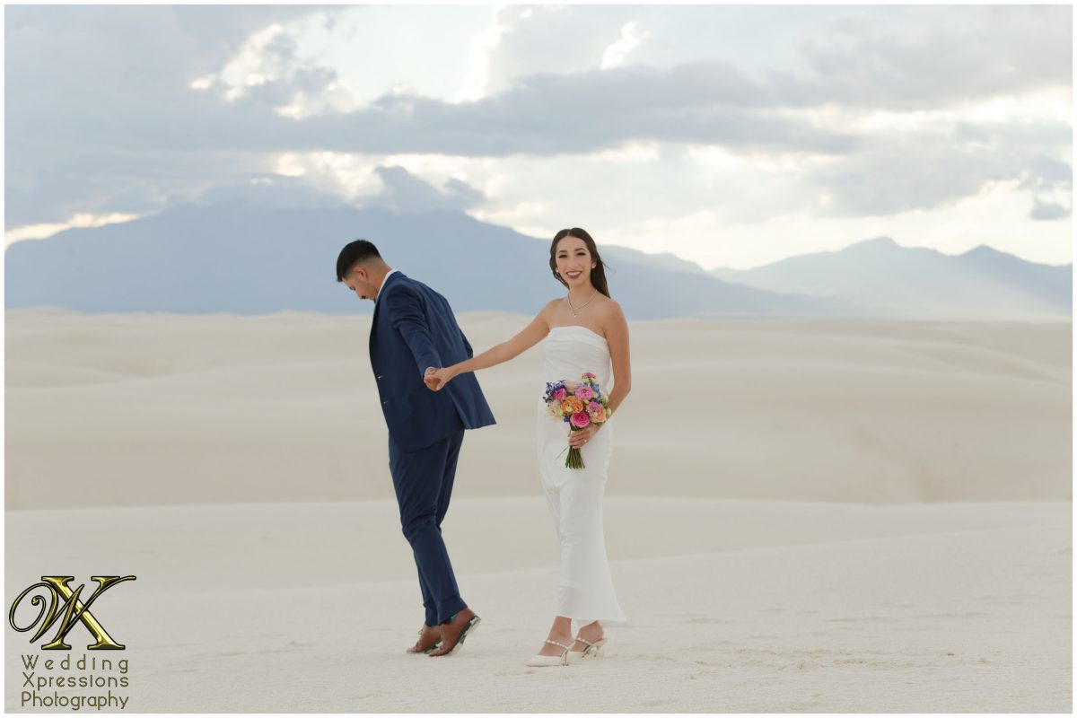Alan whispering to Illiana on the dunes.