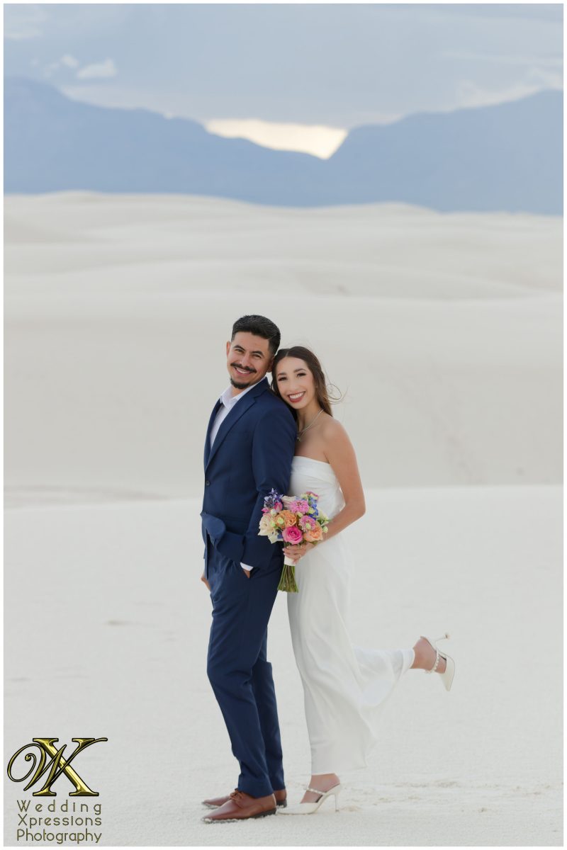 Close portrait of Alan and Illiana smiling at White Sands.
