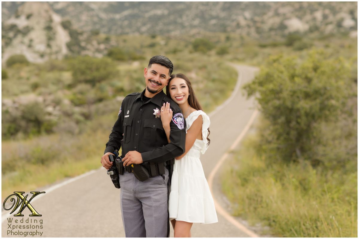 Couple in uniforms smiling together at Aguirre Springs.
