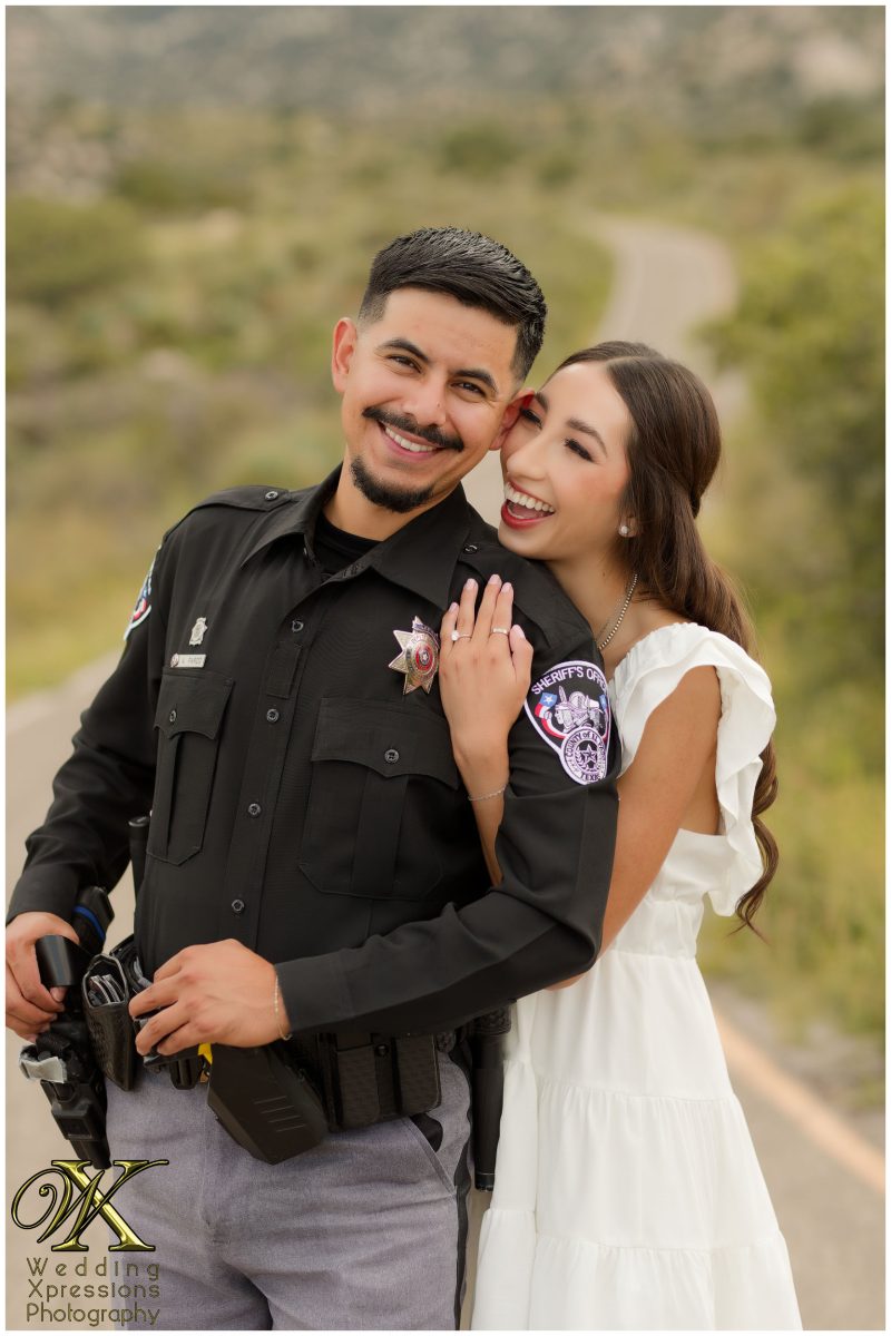 Close portrait of Alan and Illiana in their professional attire.