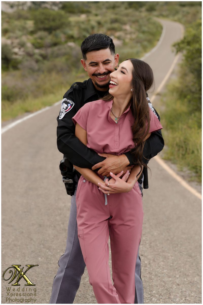 Couple in uniform looking at each other at Aguirre Springs.