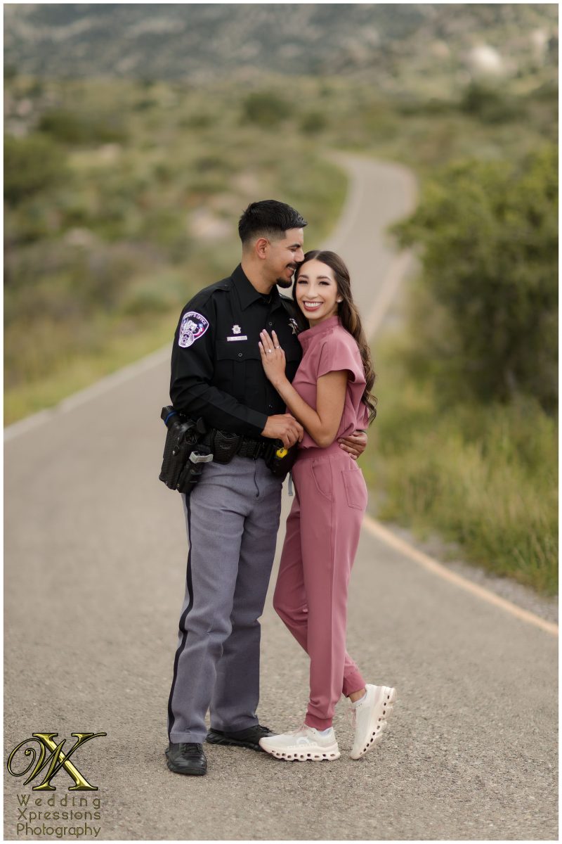 Alan in police uniform and Illiana in scrubs at Aguirre Springs.