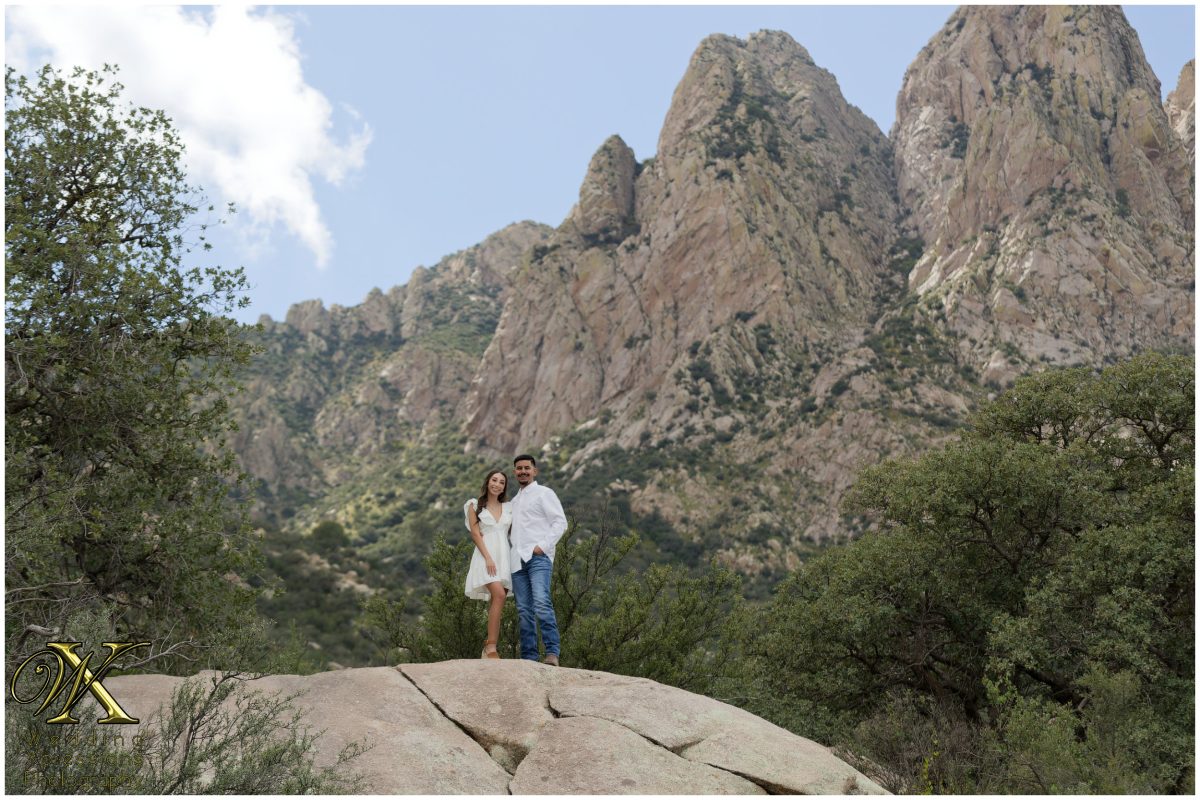 Alan and Illiana standing together in the rugged mountains.