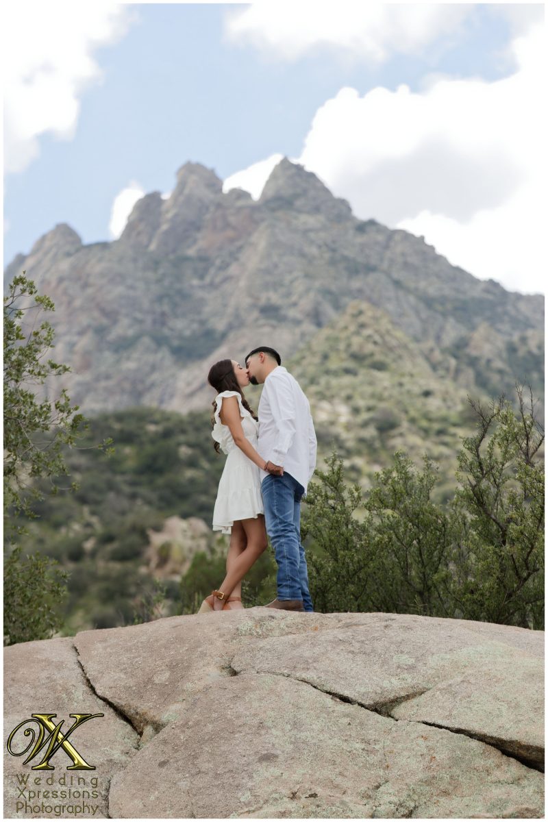 Alan and Illiana embracing with Organ Mountains in the background.