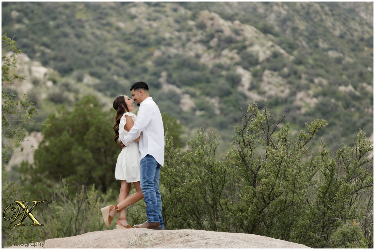 Couple sitting on a rock at Aguirre Springs.
