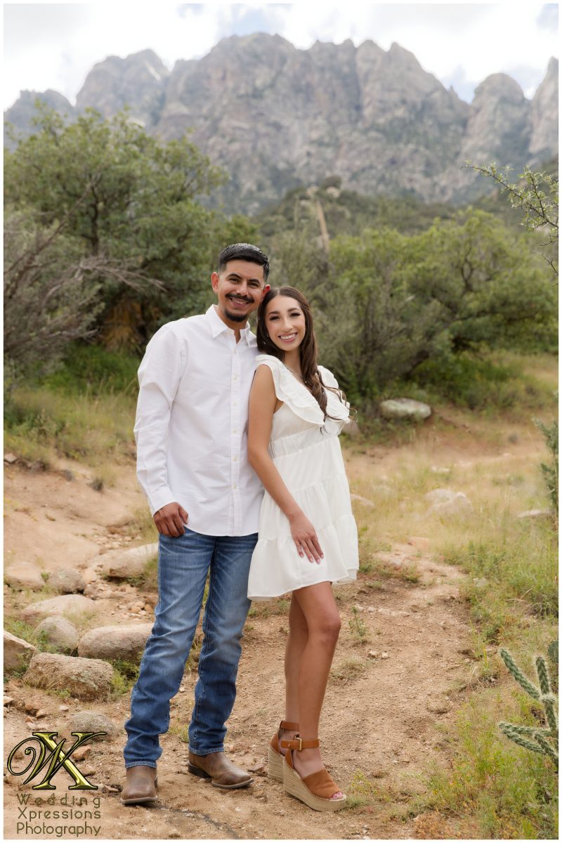 Couple in casual outfits smiling at Aguirre Springs.