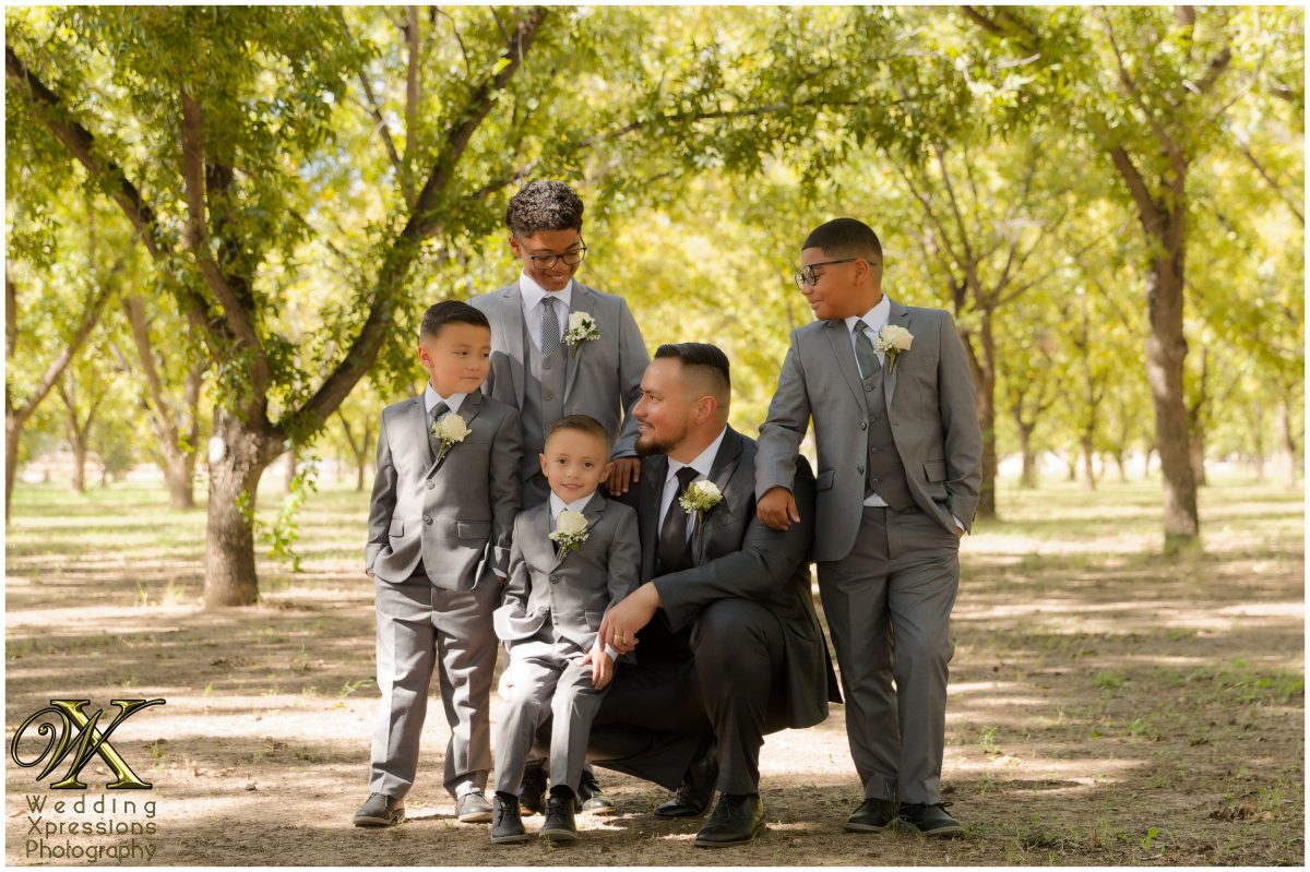 Casual and authentic family moment in the orchard, showing a joyful connection.