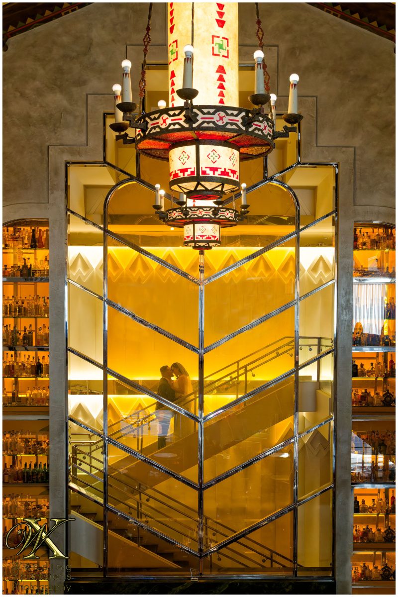 Gold-accented two story high windows at The Plaza Hotel bar, capturing the venue's luxury vibe.