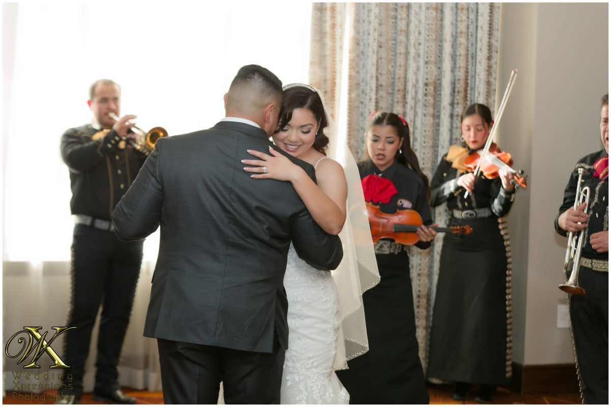 Heartfelt embrace during the couple’s first dance at The Plaza Hotel Pioneer Park.