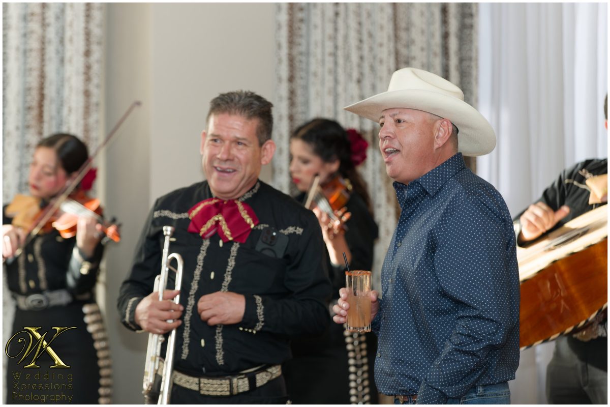 Traditional mariachi band with bride’s dad performing for guests at the El Paso wedding reception.