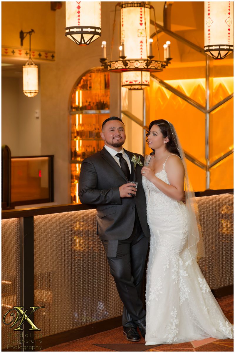 The couple listening to a heartfelt speech from their family and friends.
