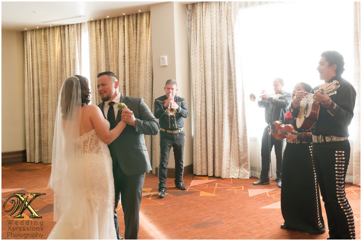 Joyful dancing with family members during the intimate reception celebration.