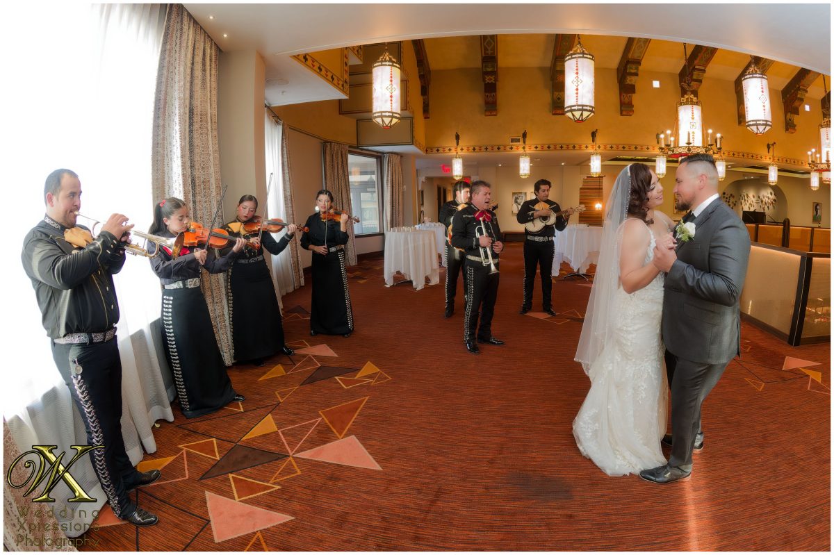 Wide shot of the reception celebration, showing the vibrant energy of the night.