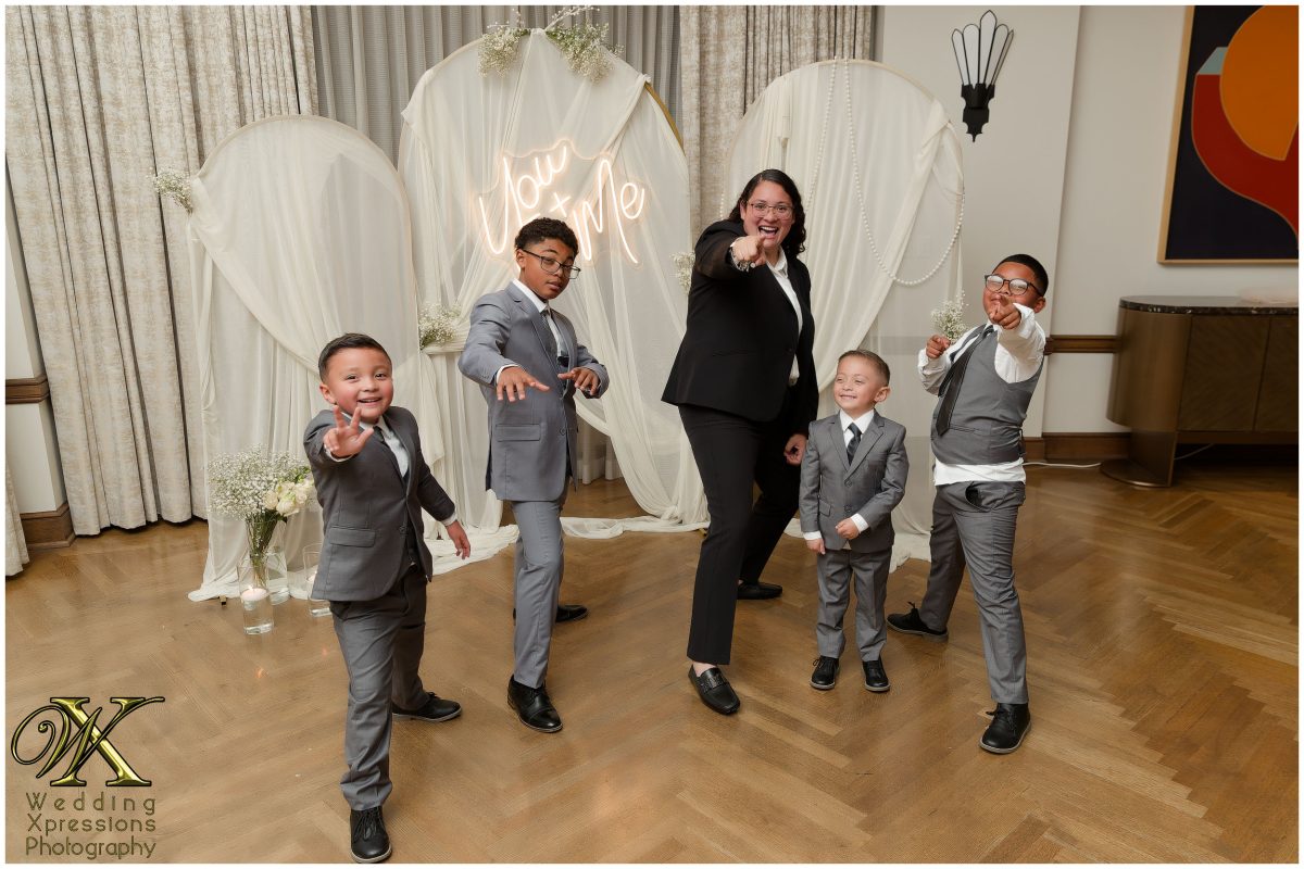 Family group portrait at the reception, celebrating their shared bond.