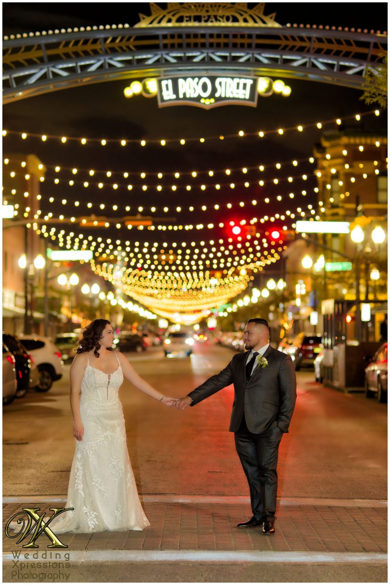 Christian and Melissa walking through downtown El Paso at night.