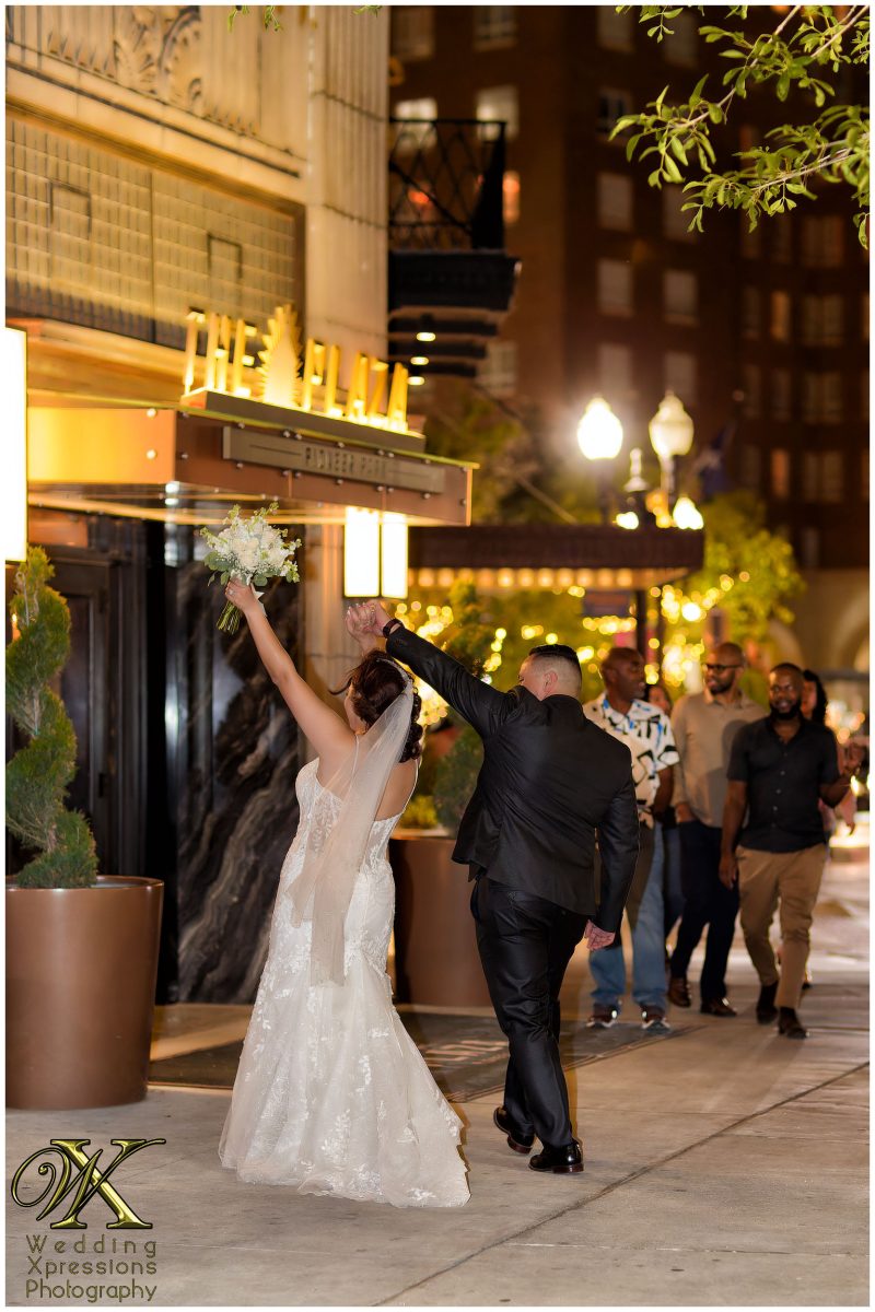 Final celebratory night portrait of Christian and Melissa in downtown El Paso.