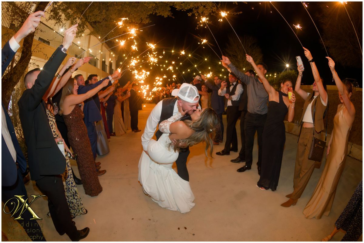 Grand sparkler exit at Kendall Point wedding with long line of guests.